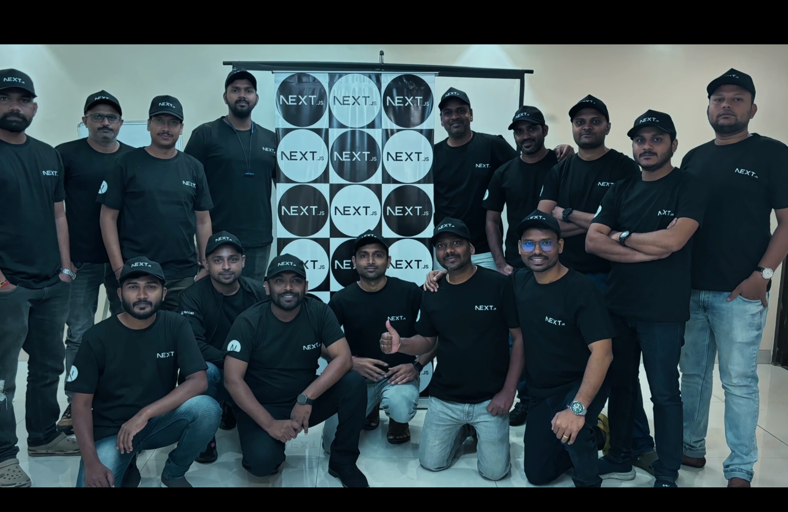 Next.conf Launch Party September 2023 - Group photo with Next.js branded backdrop